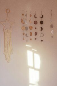 Beautiful wall hanging featuring moon and star designs with soft natural light.